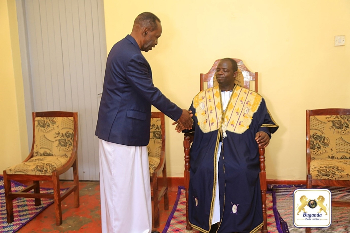 Oweek. Patrick Luwaga Mugumbule, Speaker of the Buganda Lukiiko, installing Oweek Deo Kagimu as the new Ssingo County Chief Image